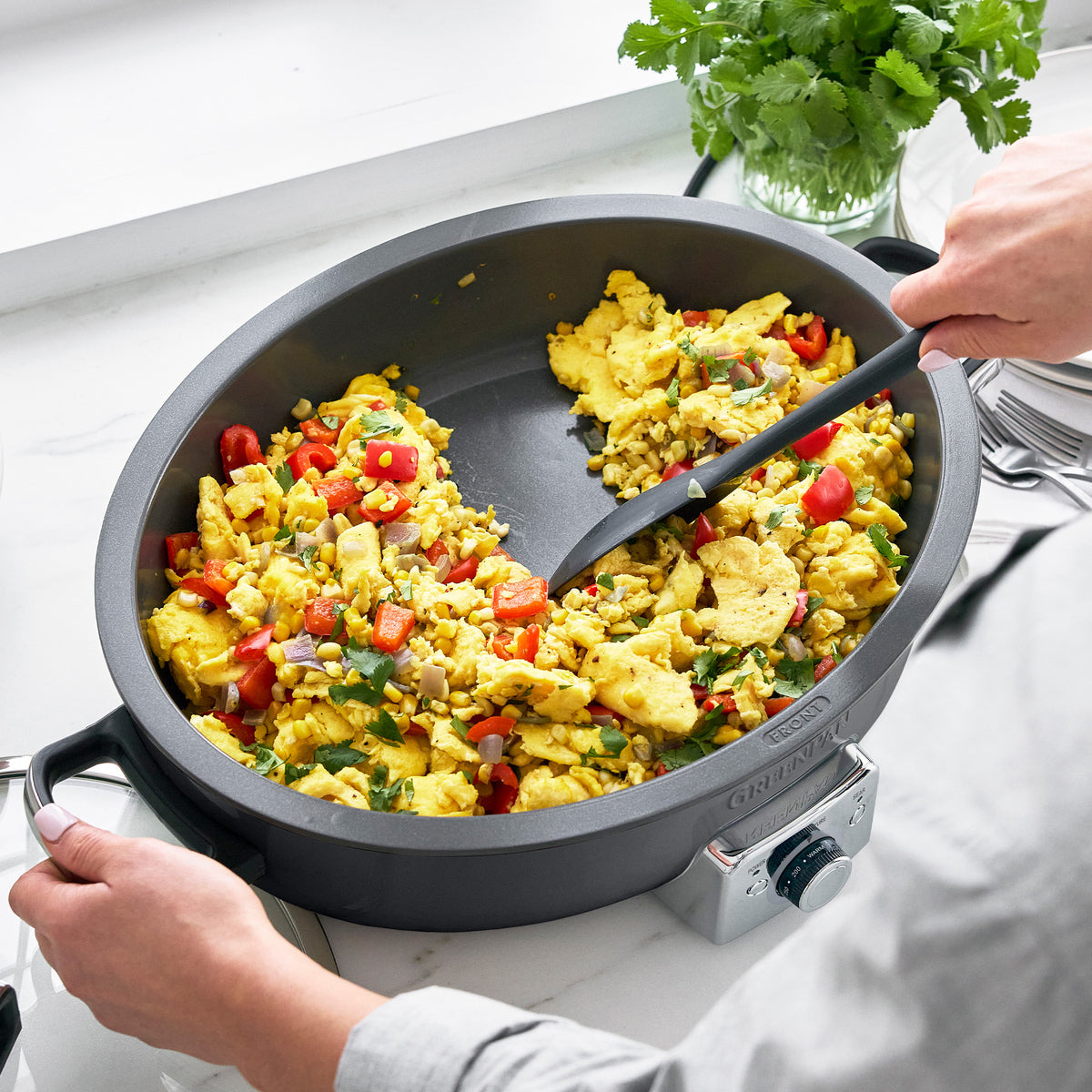 Oval electric skillet with stay-cool handles