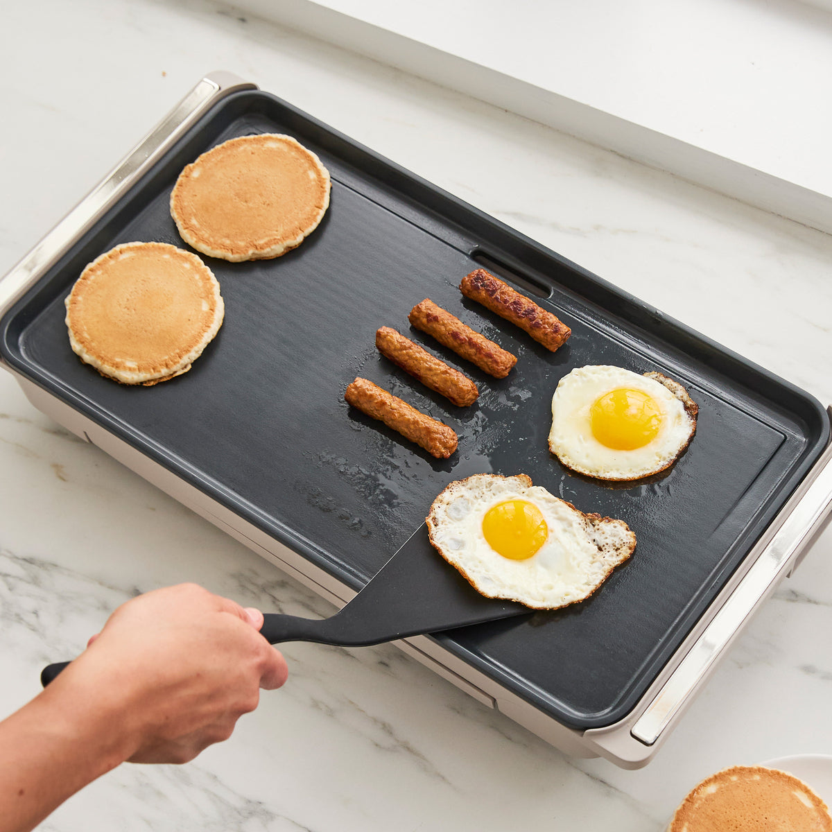 Advanced griddle with cool-touch handles