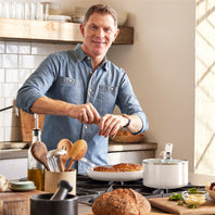 Bobby Flay cooking with aluminum cookware set