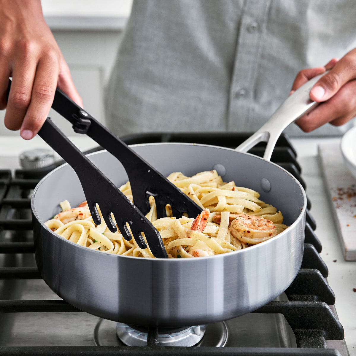 Silicone pasta tongs with a sturdy steel core