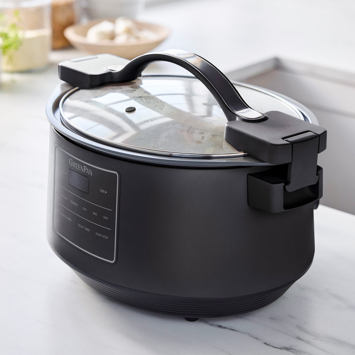 Slow cooker with built-in cord wrap