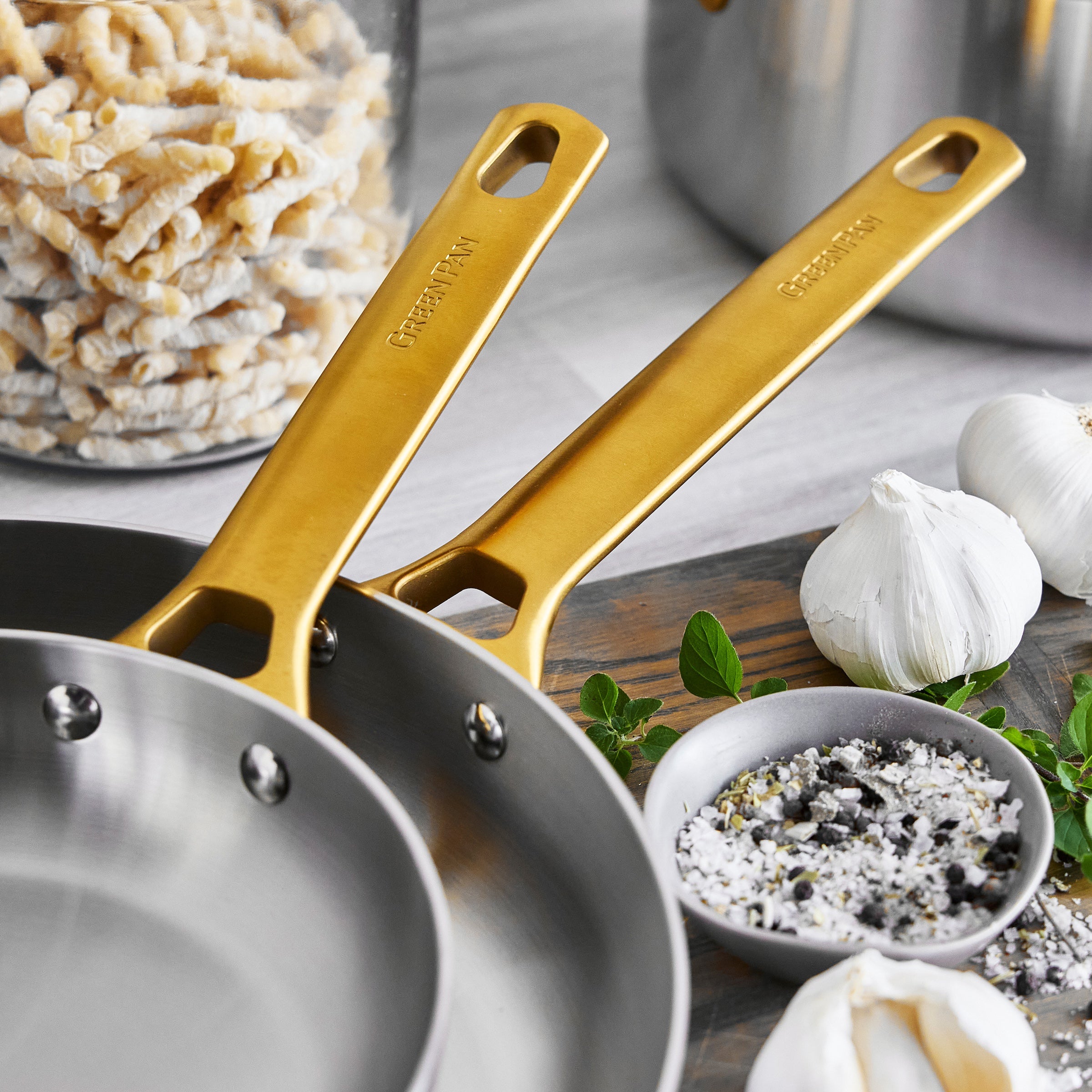 Stainless steel frypans with gold-tone handles