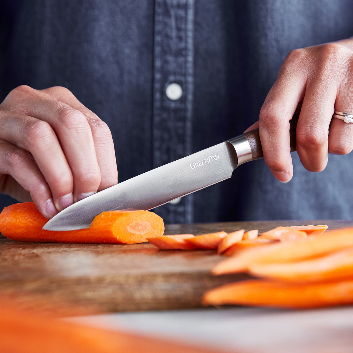 Slicing a carrot with a utility knife