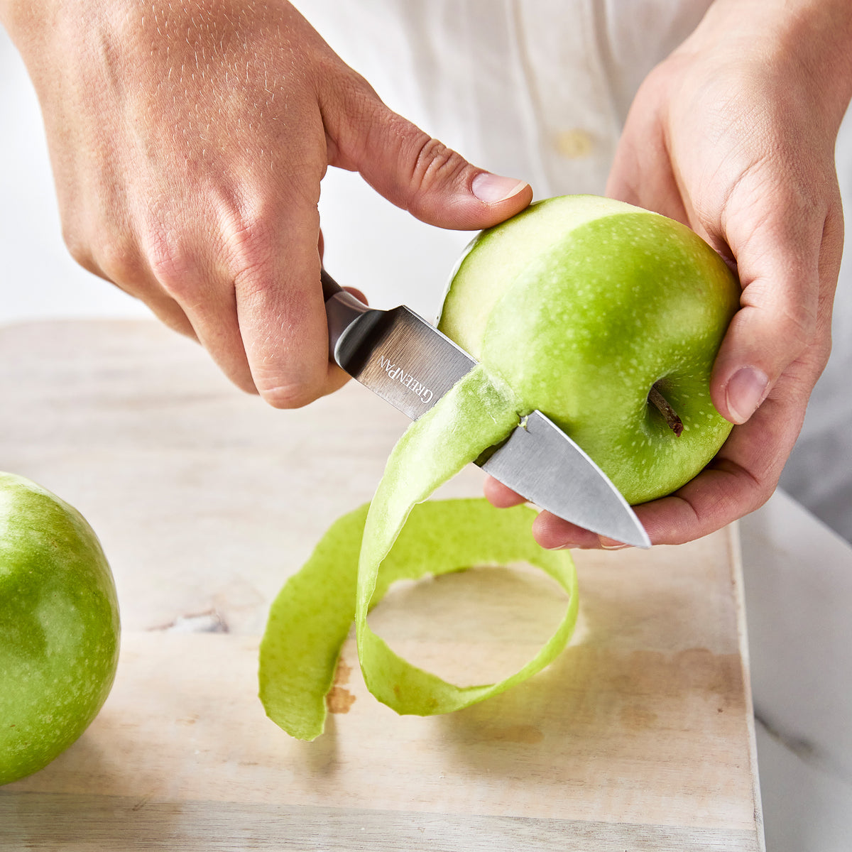 Slicing an apple with a paring knife