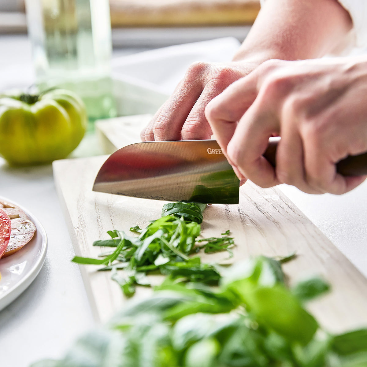 Slicing herbs with a Santoku knife