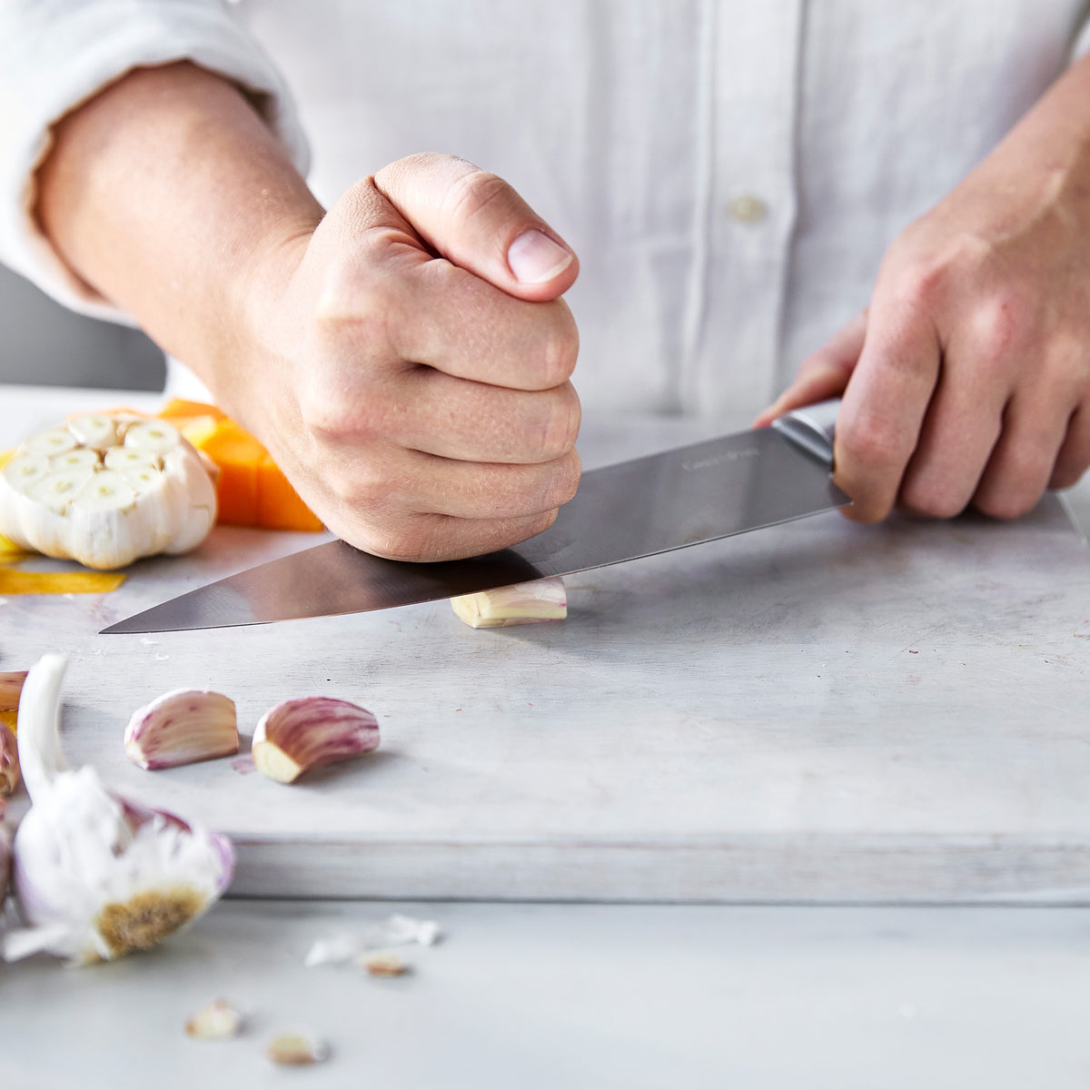 Smashing garlic with a chef's knife